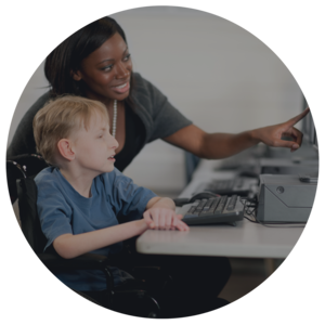 ADult woman and youth looking at computer screen