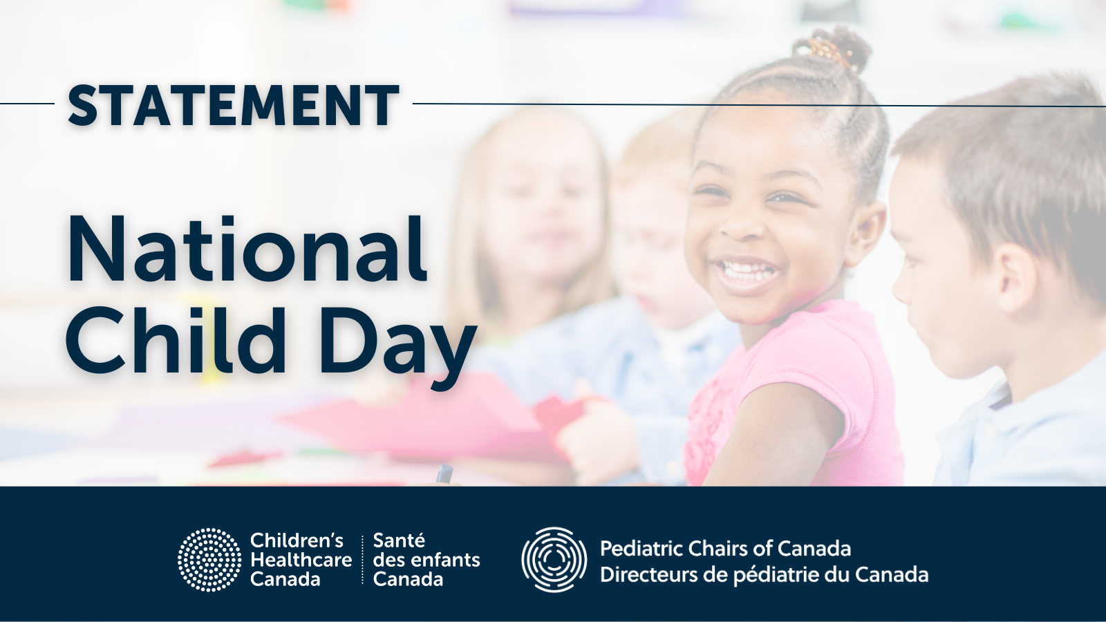 young girl smiling in class with her peers. Text reads "National Child Day Statement"