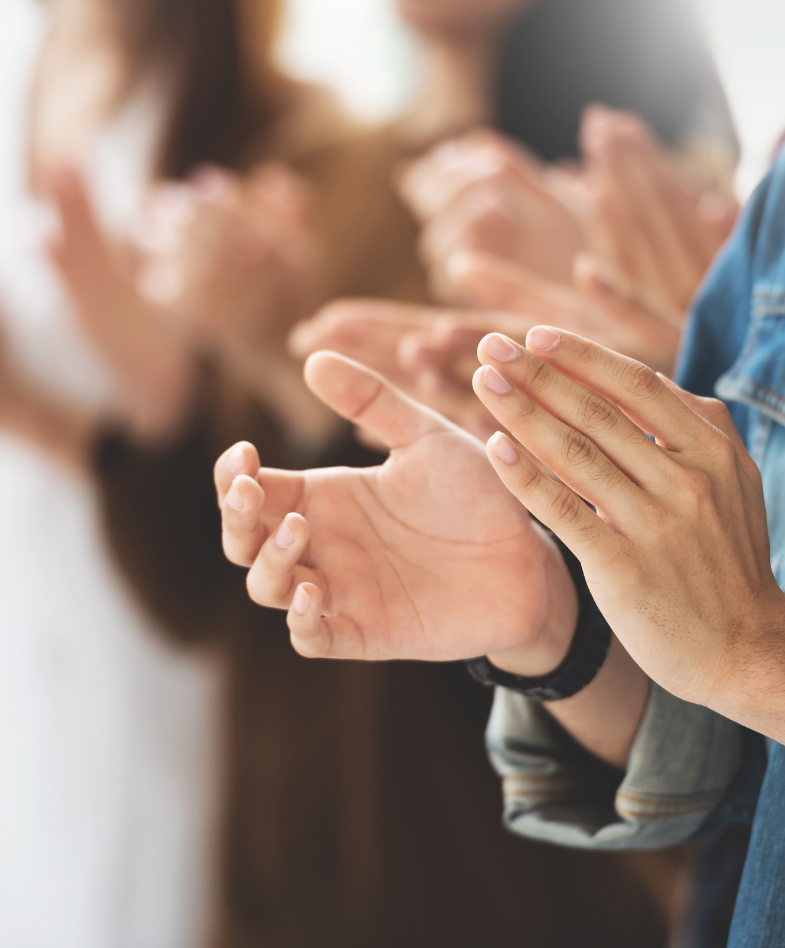 group of people clapping hands